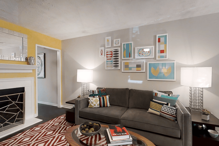 Elegantly designed living room with modern furnishings in an apartment at Cortland at the Village in Smyrna, Atlanta