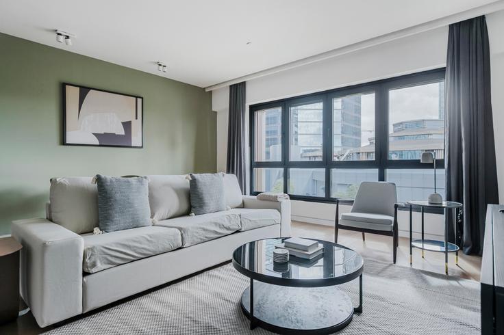 Elegantly designed living room with modern furnishings in an apartment at Soyak Soho in Esentepe, Istanbul