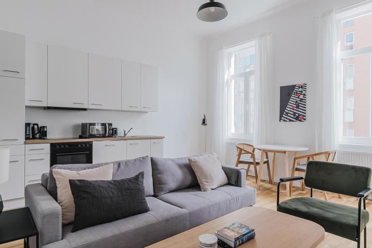 Sala de estar elegantemente projetada com móveis modernos em um apartamento no Schlachthausgasse 14 em Vienna, Vienna Sala de estar elegantemente projetada com móveis modernos em um apartamento no Schlachthausgasse 14 em Vienna, Vienna