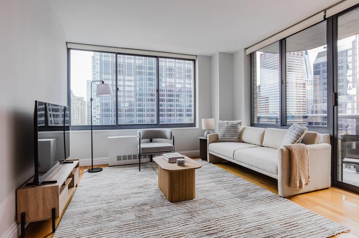 Elegantly designed living room with modern furnishings in an apartment at The Ritz Plaza in Midtown West, New York