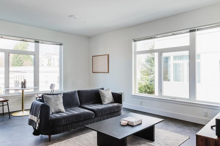 Elegantly designed living room with modern furnishings in an apartment at HiLite Apartments in First Hill, Seattle