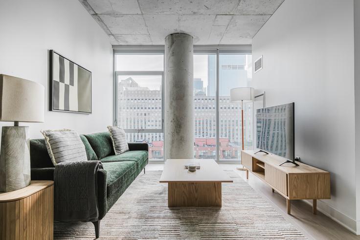 Elegantly designed living room with modern furnishings in an apartment at 3Eleven in River North, Chicago