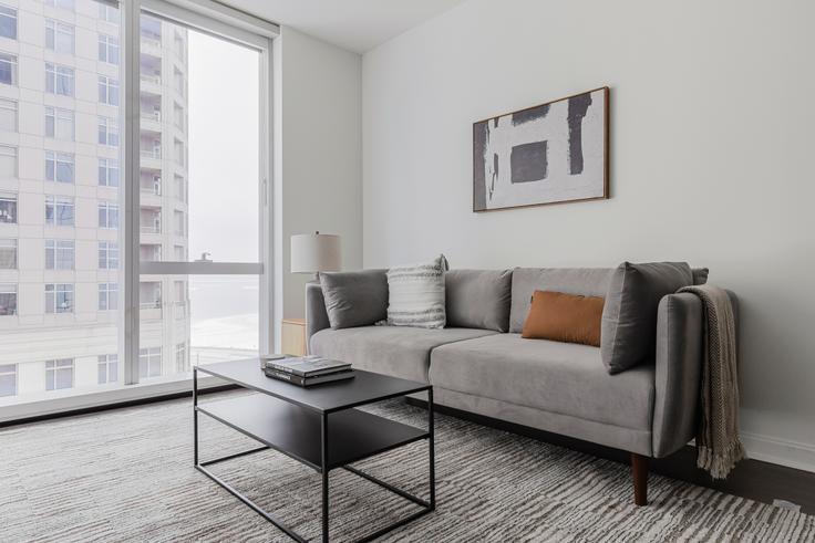 Elegantly designed living room with modern furnishings in an apartment at 500 Lake Shore in Streeterville, Chicago