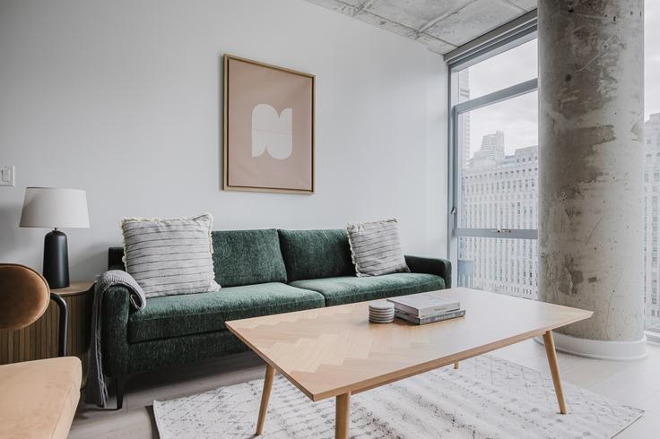 Elegantly designed living room with modern furnishings in an apartment at 3Eleven in River North, Chicago