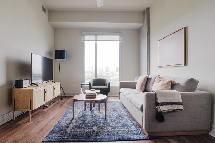 Elegantly designed living room with modern furnishings in an apartment at Seven in Austin, Austin Elegantly designed living room with modern furnishings in an apartment at Seven in Austin, Austin
