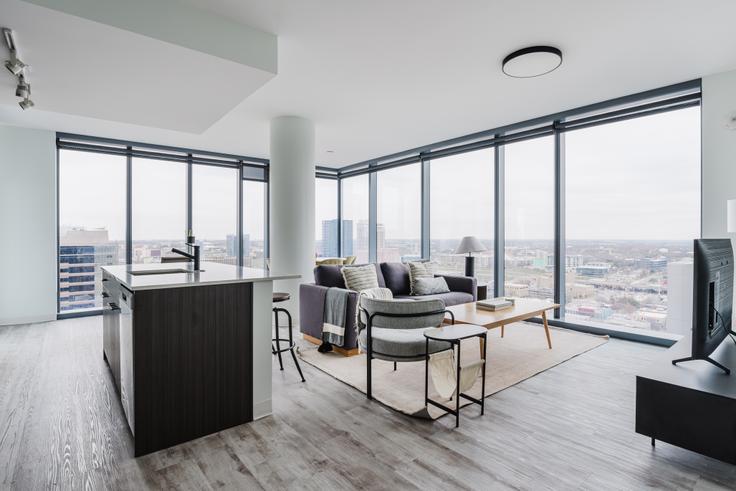 Elegantly designed living room with modern furnishings in an apartment at Sienna at the Thompson in Downtown, Austin