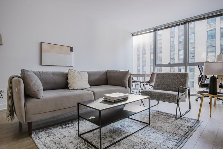 Elegantly designed living room with modern furnishings in an apartment at Mila in The Loop, Chicago