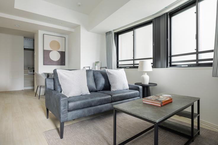 Elegantly designed living room with modern furnishings in an apartment at The Parkhabio Ichigaya East in Ichigaya, Tokyo