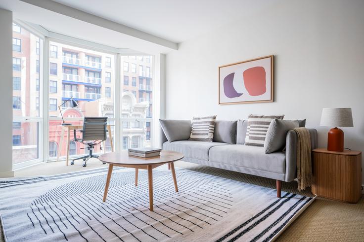 Elegantly designed living room with modern furnishings in an apartment at The Lansburgh in Penn Quarter, Washington D.C.