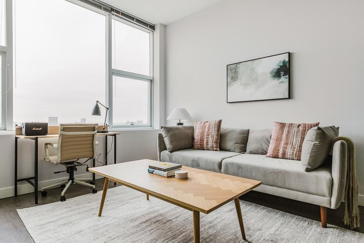 Elegantly designed living room with modern furnishings in an apartment at Channing avenue in South Loop, Chicago