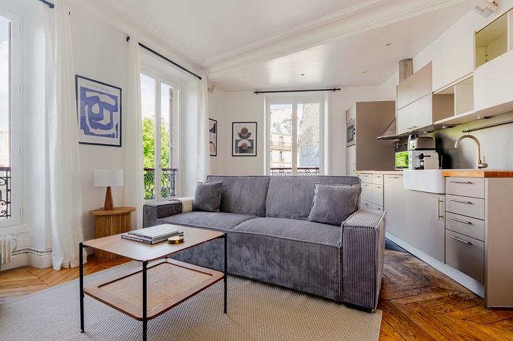 Elegantly designed living room with modern furnishings in an apartment at Blanche, 83 in 9th arrondissement, Paris Elegantly designed living room with modern furnishings in an apartment at Blanche, 83 in 9th arrondissement, Paris