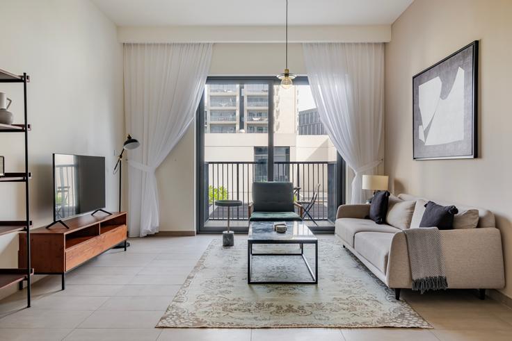 Elegantly designed living room with modern furnishings in an apartment at Executive residences in Dubai Hills Estate, Dubai Elegantly designed living room with modern furnishings in an apartment at Executive residences in Dubai Hills Estate, Dubai