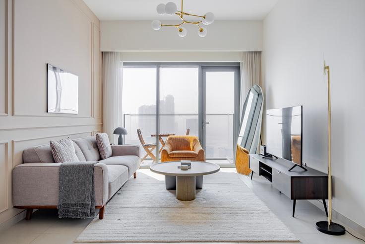 Salle de séjour élégante avec mobilier moderne dans un appartement à Burj Royale à Downtown Dubai, Dubai Salle de séjour élégante avec mobilier moderne dans un appartement à Burj Royale à Downtown Dubai, Dubai