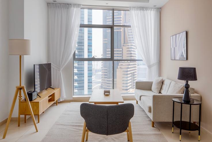 Salle de séjour élégante avec mobilier moderne dans un appartement à Skyview Tower à Dubai Marina, Dubai