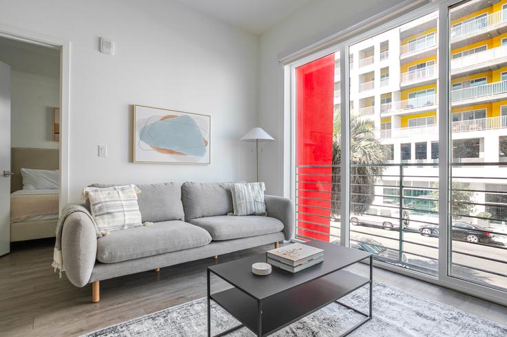 Elegantly designed living room with modern furnishings in an apartment at The Roya in Los Angeles, Los Angeles