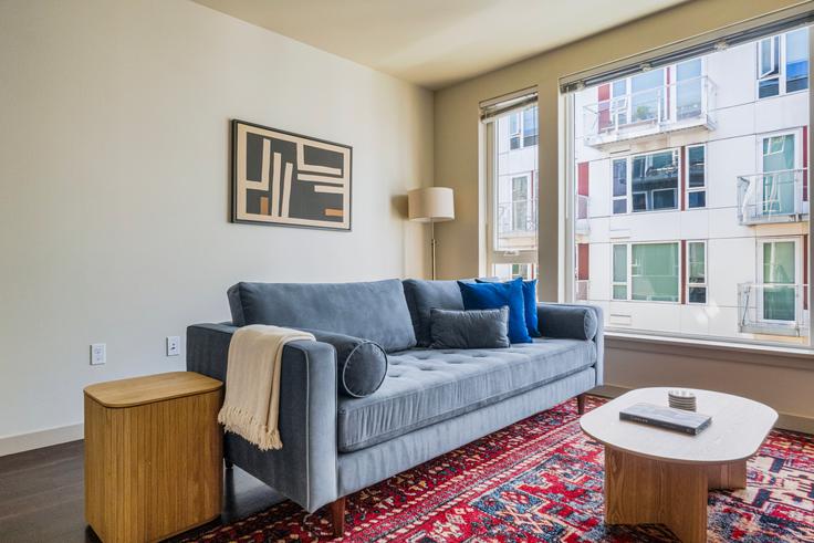 Elegantly designed living room with modern furnishings in an apartment at Infinity in Seattle, Seattle Elegantly designed living room with modern furnishings in an apartment at Infinity in Seattle, Seattle