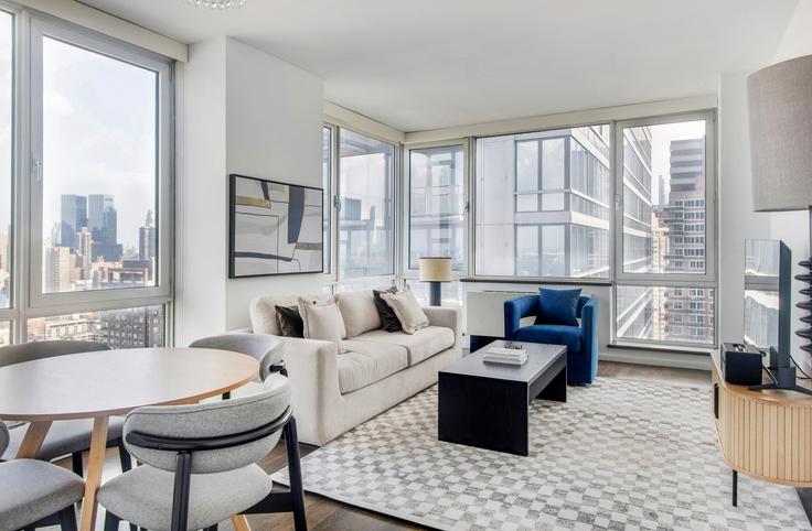 Elegantly designed living room with modern furnishings in an apartment at Atelier in Manhattan, New York