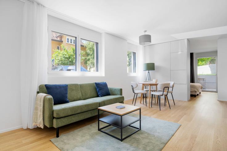 Elegantly designed living room with modern furnishings in an apartment at Stoffelstrasse 15 in District 11, Zurich Elegantly designed living room with modern furnishings in an apartment at Stoffelstrasse 15 in District 11, Zurich