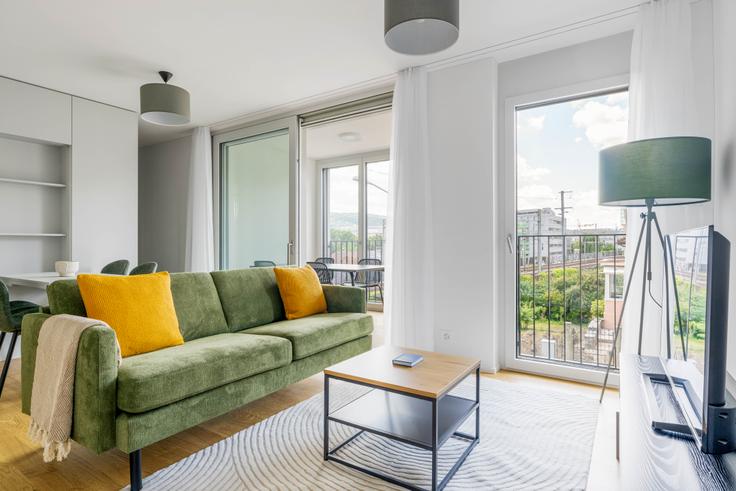 Elegantly designed living room with modern furnishings in an apartment at Stoffelstrasse 15 in District 11, Zurich Elegantly designed living room with modern furnishings in an apartment at Stoffelstrasse 15 in District 11, Zurich
