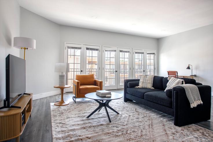 Elegantly designed living room with modern furnishings in an apartment at 1620 S. Bentley Ave in Los Angeles, Los Angeles