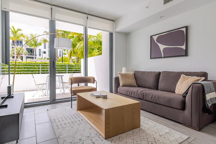 Elegantly designed living room with modern furnishings in an apartment at Adela at Mimo Bay in Miami, Miami