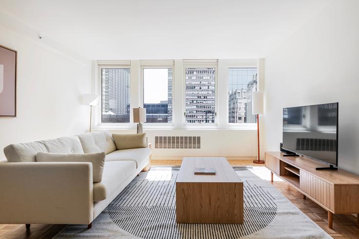 Elegant gestaltetes Wohnzimmer mit moderner Einrichtung in einer Wohnung im Ava back bay in Boston, Boston Elegant gestaltetes Wohnzimmer mit moderner Einrichtung in einer Wohnung im Ava back bay in Boston, Boston