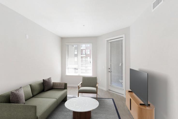 Sala de estar elegantemente projetada com móveis modernos em um apartamento no Avalon public market em Emeryville, Emeryville