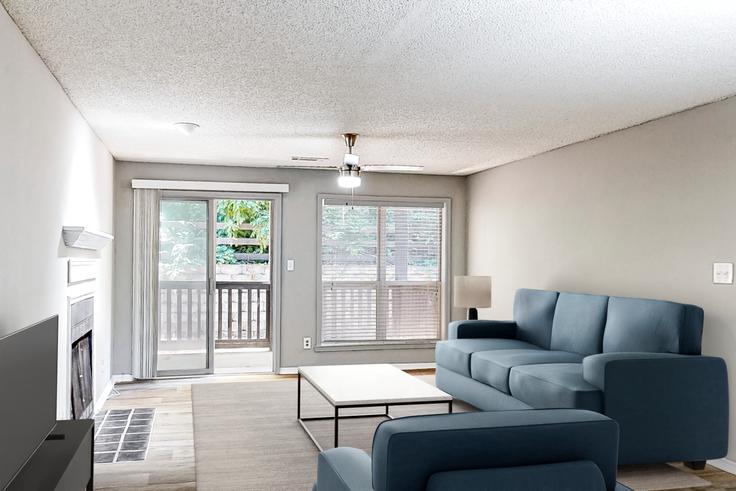 Elegante sala de estar con mobiliario moderno en un apartamento en The Addison at Sandy Springs en Sandy Springs, Sandy Springs Elegante sala de estar con mobiliario moderno en un apartamento en The Addison at Sandy Springs en Sandy Springs, Sandy Springs