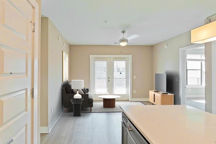 Elegantly designed living room with modern furnishings in an apartment at Cortland At The Battery Atlanta in Cumberland, Atlanta