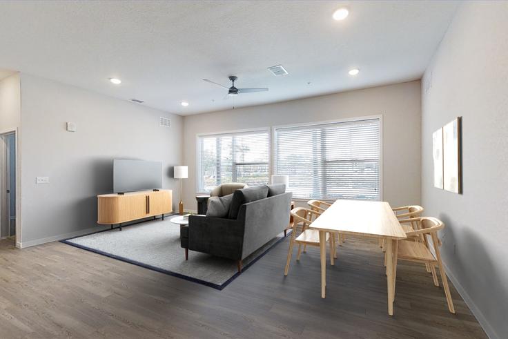 Elegantly designed living room with modern furnishings in an apartment at Cortland on Orange in Lake Holden, Orlando