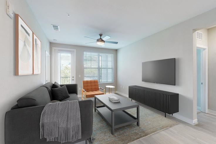 Elegante sala de estar con mobiliario moderno en un apartamento en Cortland Nona en Orlando, Orlando