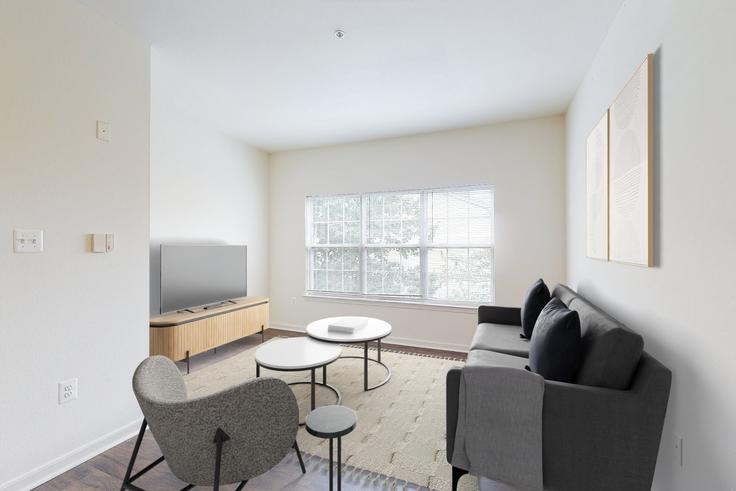 Sala de estar elegantemente projetada com móveis modernos em um apartamento no Eaves washingtonian center em Gaithersburg, Gaithersburg
