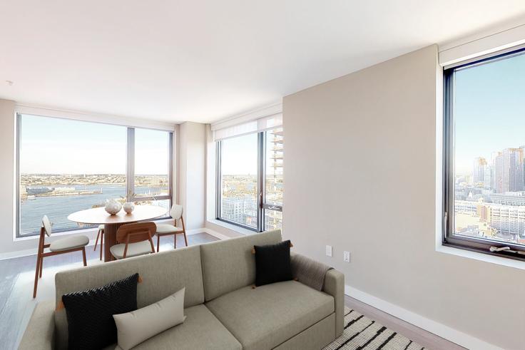 Sala de estar elegantemente projetada com móveis modernos em um apartamento no Avalon north station em Boston, Boston