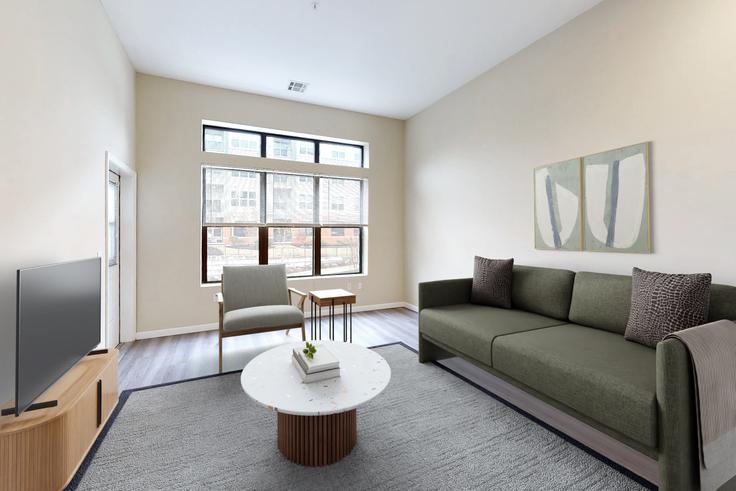 Elegant gestaltetes Wohnzimmer mit moderner Einrichtung in einer Wohnung im Avalon quincy in Quincy, Quincy Elegant gestaltetes Wohnzimmer mit moderner Einrichtung in einer Wohnung im Avalon quincy in Quincy, Quincy