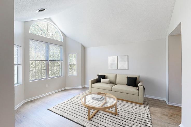 Sala de estar elegantemente projetada com móveis modernos em um apartamento no Avalon burlington em Burlington, Burlington Sala de estar elegantemente projetada com móveis modernos em um apartamento no Avalon burlington em Burlington, Burlington