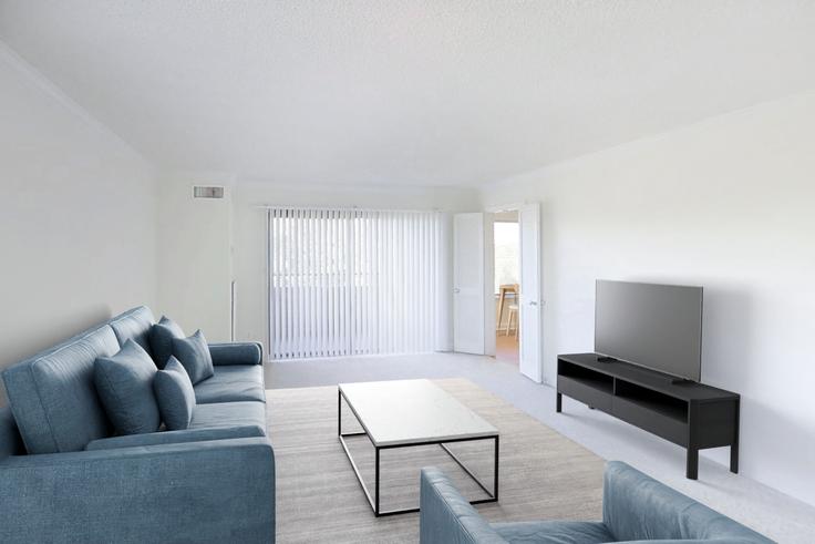 Elegant gestaltetes Wohnzimmer mit moderner Einrichtung in einer Wohnung im Avalon at foxhall in Washington, Washington