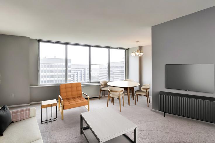 Sala de estar elegantemente projetada com móveis modernos em um apartamento no Crystal Plaza em Arlington, Arlington Sala de estar elegantemente projetada com móveis modernos em um apartamento no Crystal Plaza em Arlington, Arlington