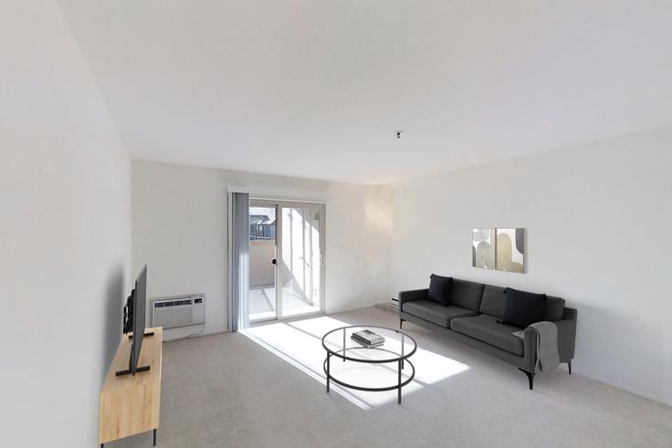 Sala de estar elegantemente projetada com móveis modernos em um apartamento no Avalon mountain view em Mountain View, Mountain View