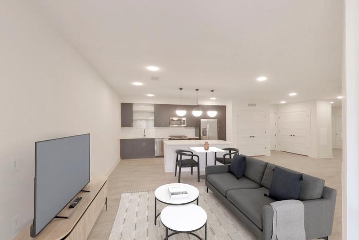 Elegantly designed living room with modern furnishings in an apartment at Rino-1 in Denver, Denver Elegantly designed living room with modern furnishings in an apartment at Rino-1 in Denver, Denver